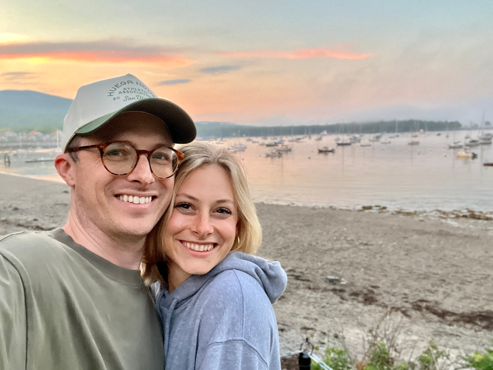 TJ with his wife at the harbor at sunset