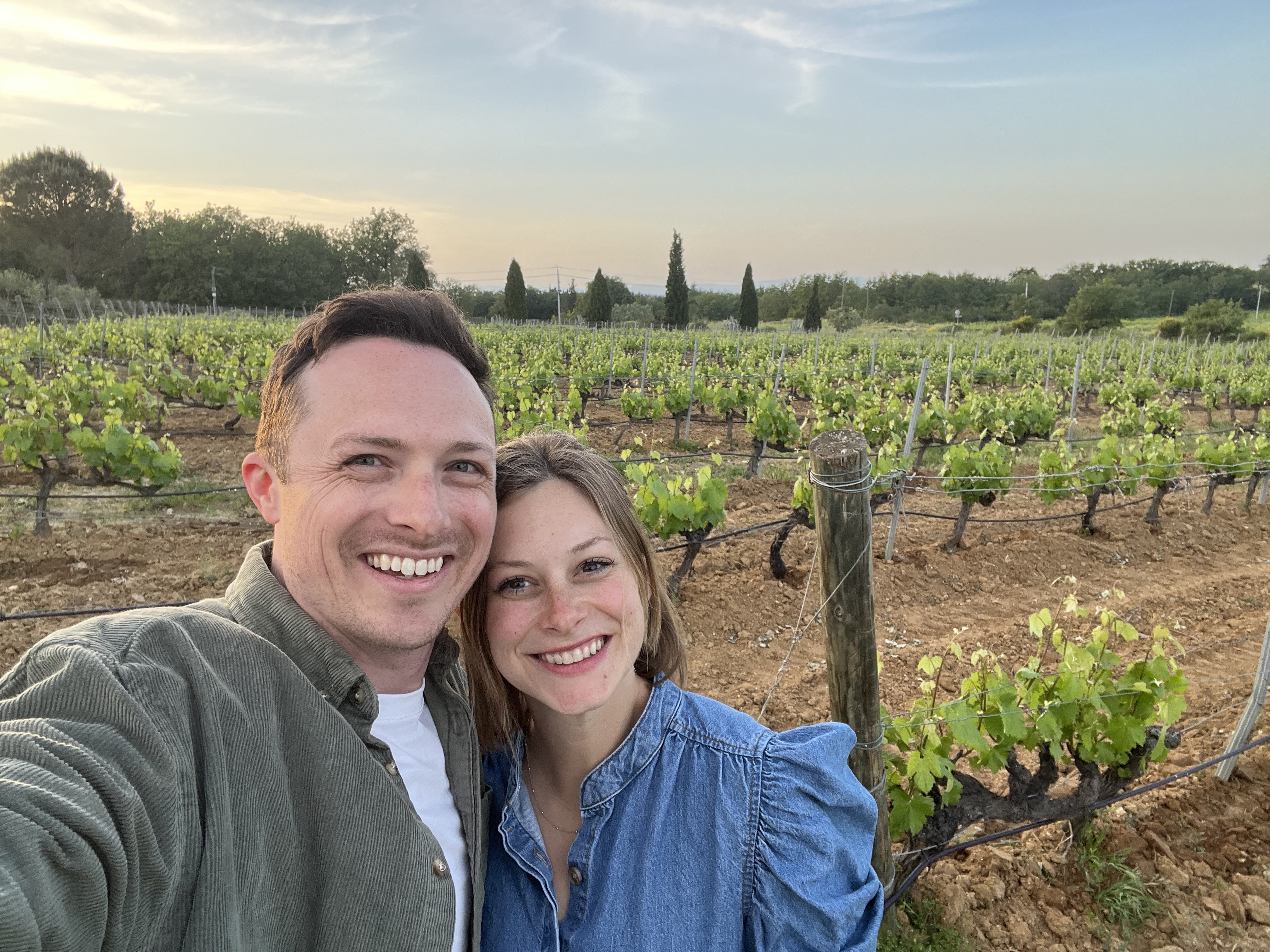 TJ and his wife at a vineyard